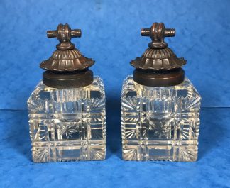 A Pair Of Cut Glass Inkwells with Bronze Lids