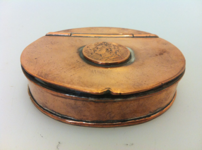 Copper oval shaped tobacco tin with George IV 1820 Farthing